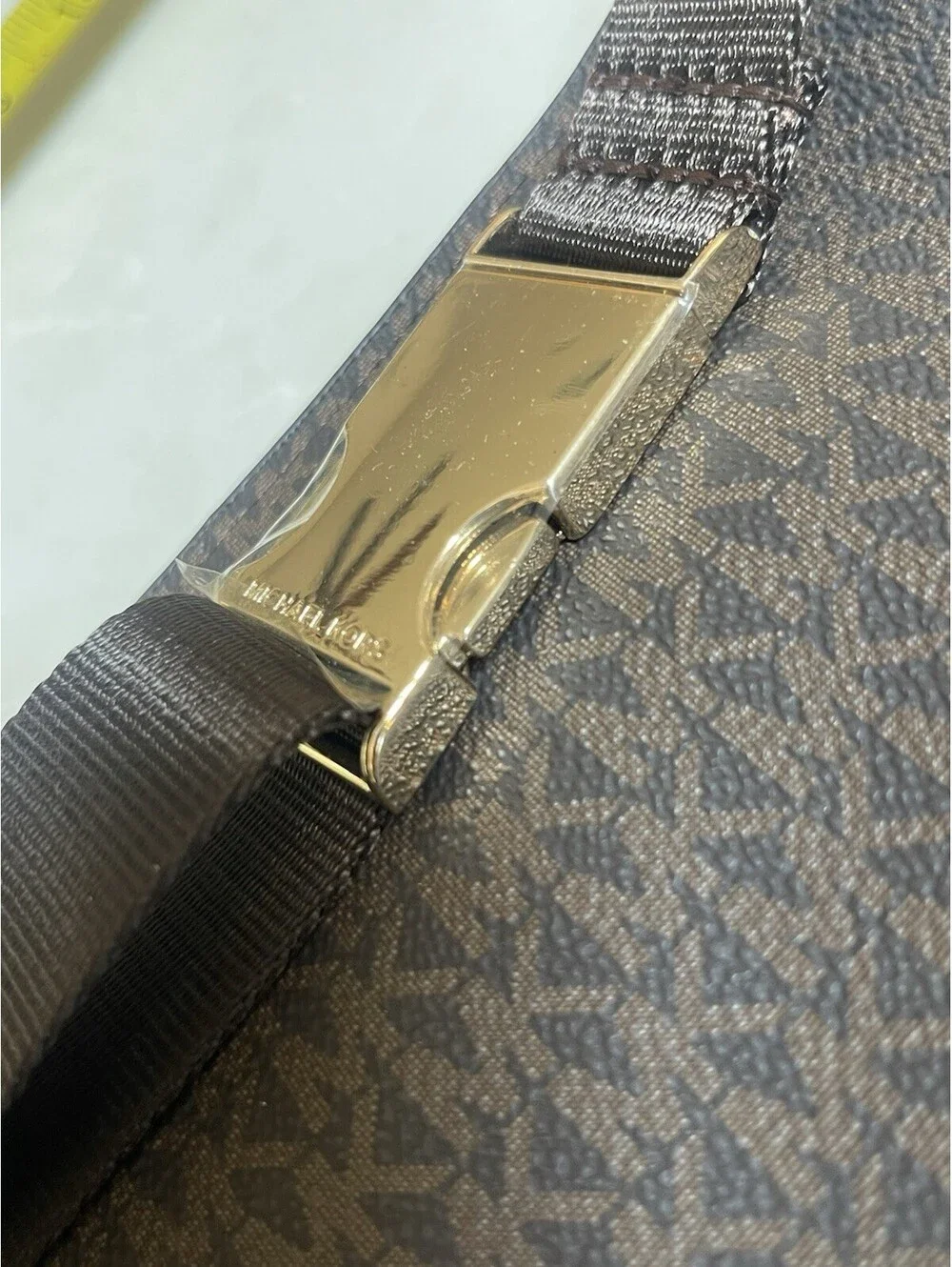 Michael Kors Logo Double-Zip Fanny Pack in brown with gold-tone hardware